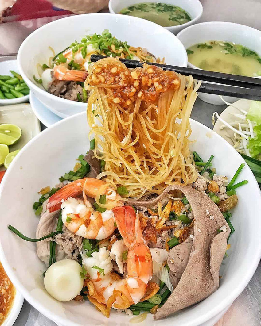 Breakfast in Vietnam Hu tieu (Vietnamese rice noodle soup)