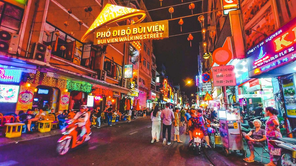 Experience lively nightlife and street food on Bui Vien Street
