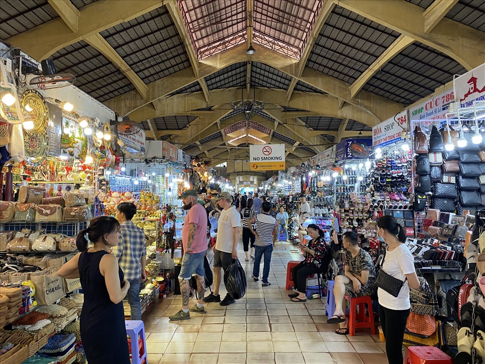 Shop local goods and street food at Ben Thanh Market