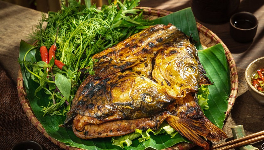Thac Ba Lake Freshly grilled fish served with local herbs