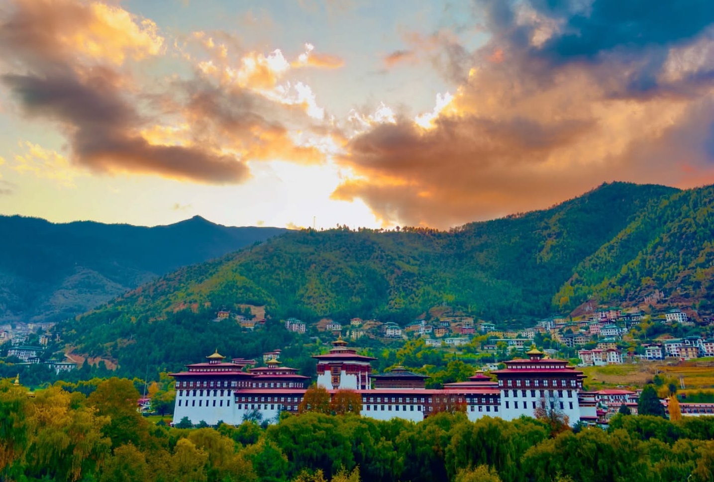 Cheap holiday destinations from Singapore Tashichho Dzong glowing at sunset in the heart of Thimphu