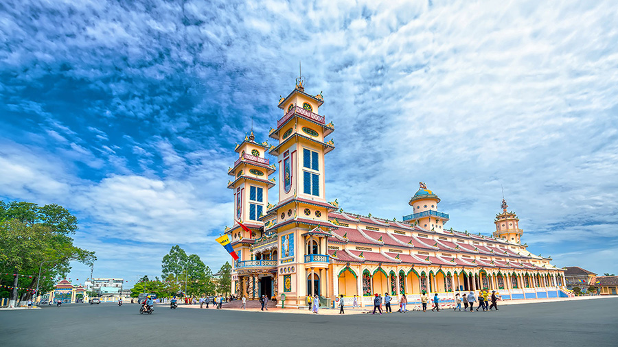 Explore the Holy See of the Cao Dai religion at Tay Ninh, a sacred place to visit